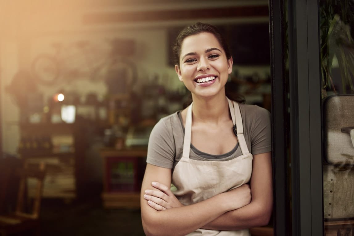 Woman smiling with her arms crossed